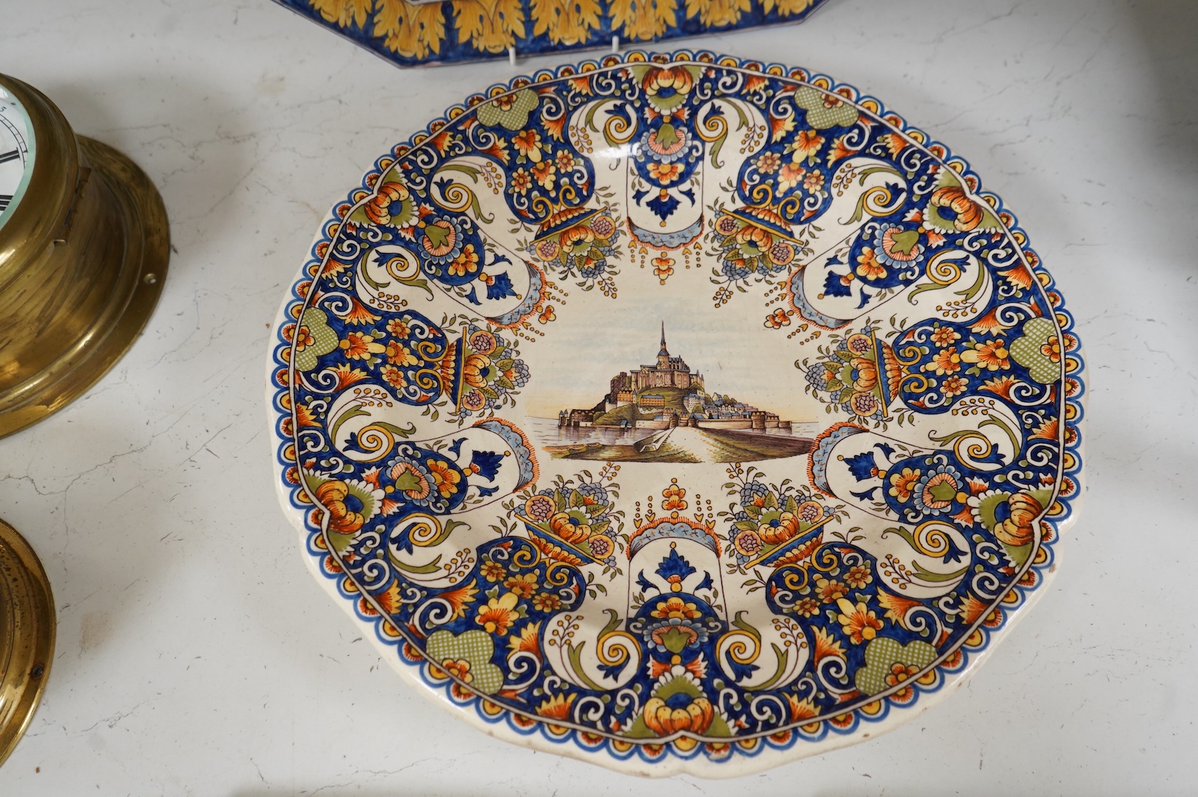 Four various late 19th century French faience dishes/stands, including a Nevers canted rectangular meat dish, largest 46cm wide